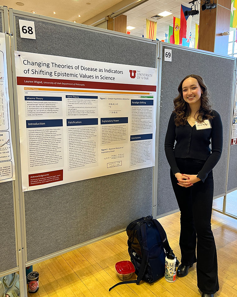 Lauren Wigod standing in front of research poster