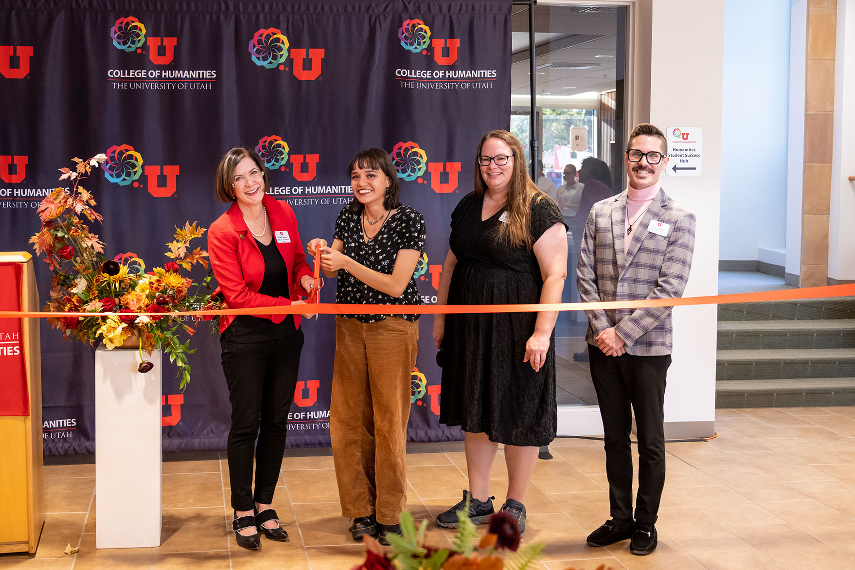 Dean Robbins cutting the ribbon at the Student Hub opening.