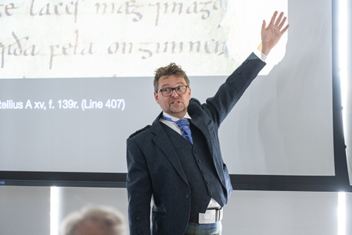 Chris Jones pointing at screen while giving lecture