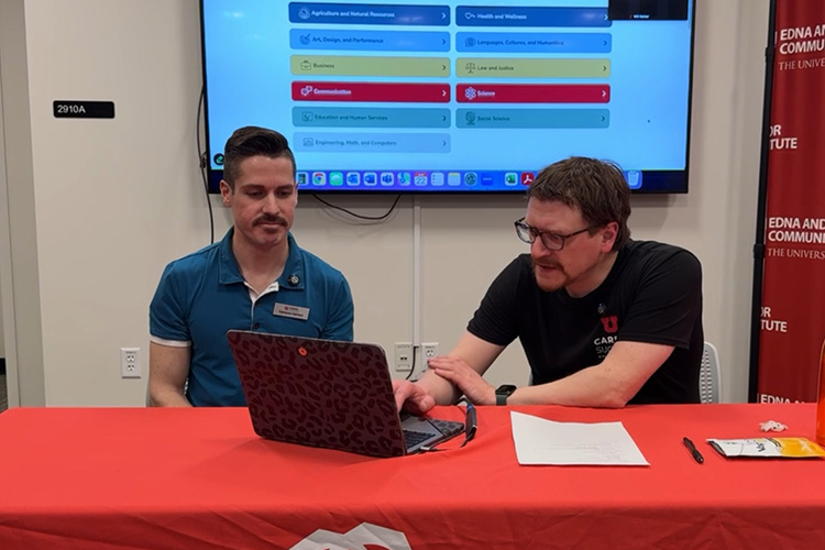 Two men on a laptop