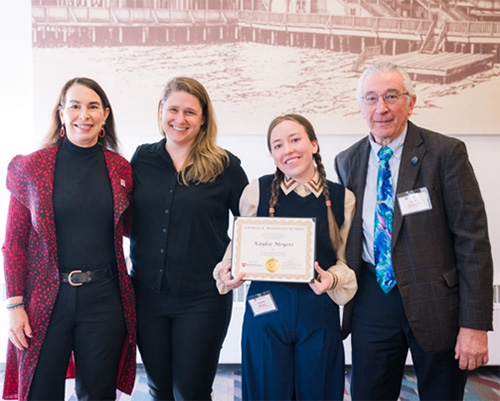 Kaylee holding plaque with mentors and Dean