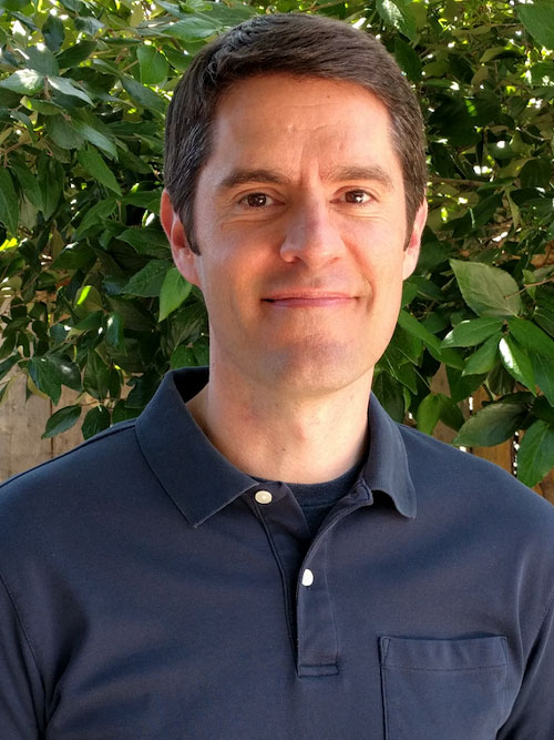 Kevin Coe smiles at the camera