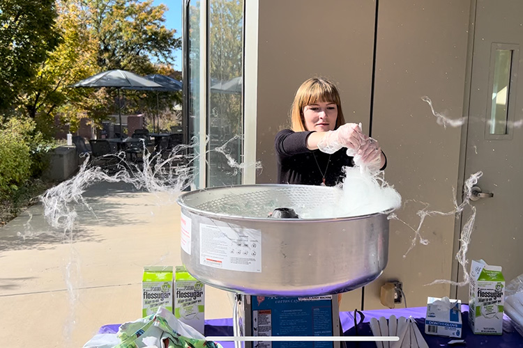 Kira making cotton candy