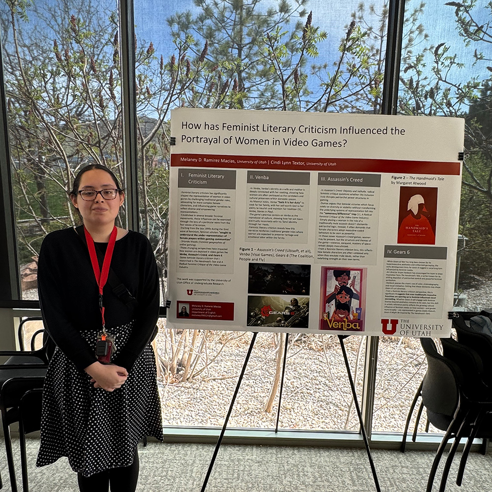 Melaney standing with her search poster on the right-side.