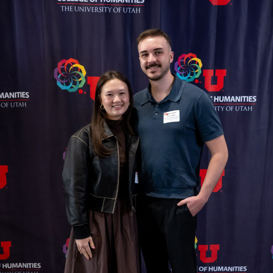 Casey standing with his arm around a young woman